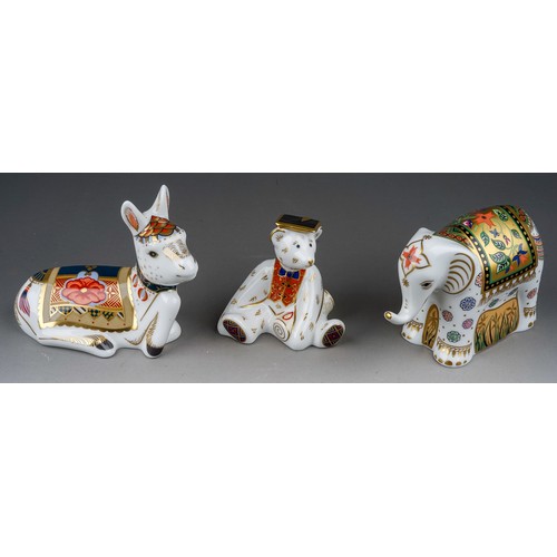 459 - Three Royal crown Derby paperweights, comprising infant Indian Elephant, Donkey Foal and Graduate (t... 