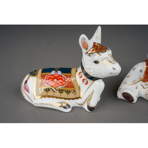 459 - Three Royal crown Derby paperweights, comprising infant Indian Elephant, Donkey Foal and Graduate (t... 