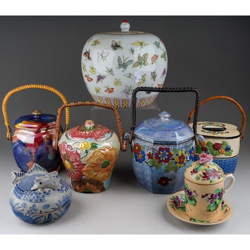 488 - A collection of ceramics to include: four various early 20th Century biscuit barrels and covers all ... 