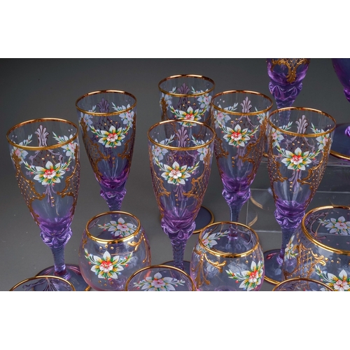 506 - A twenty-three piece Murano Cenesese Vetri liqueur set of purple glass, transfer printed, enamelled ... 