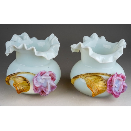 509 - A pair of 20th century milk glass vases of bulbous form, wavy rims, applied with an amber and pink g... 