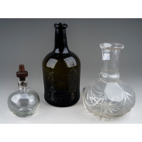 512 - A collection of two glass bottles and a decanter, the 19th century green glass bottle height 21cm, a... 