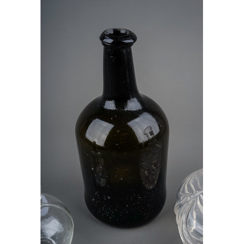 512 - A collection of two glass bottles and a decanter, the 19th century green glass bottle height 21cm, a... 