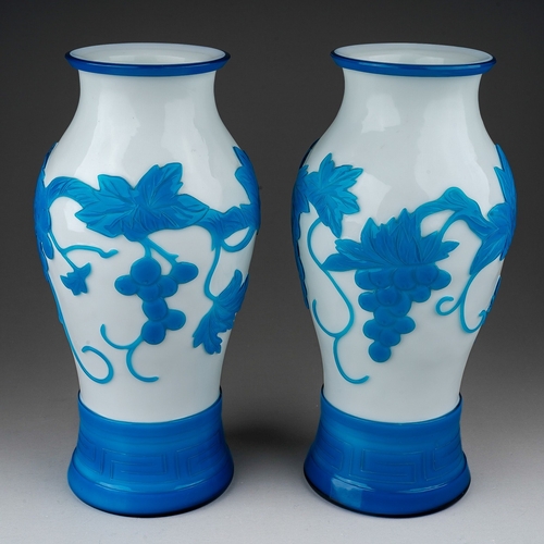 514 - A pair of Peking cameo glass blue and white vases, the white ground overlaid with a central band of ... 