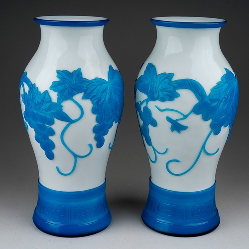 514 - A pair of Peking cameo glass blue and white vases, the white ground overlaid with a central band of ... 