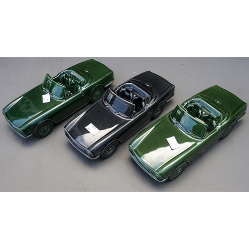 543 - Three Triumph TR6 ceramic sports car models