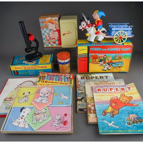 571 - A box of vintage children's toys and other juvenalia, including a boxed OK of Hong Kong 'Noddy and D... 