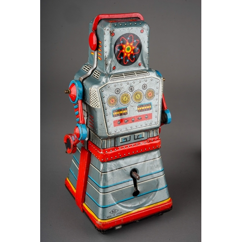 574 - A 1960's KO Yoshiya Japanese tin plate Action Atom robot, friction driven, height 16cm, together wit... 