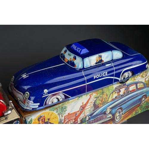 575 - A box of boxed and loose die cast, plastic and tin plate vehicles, the boxed cars comprise a Bandai ... 