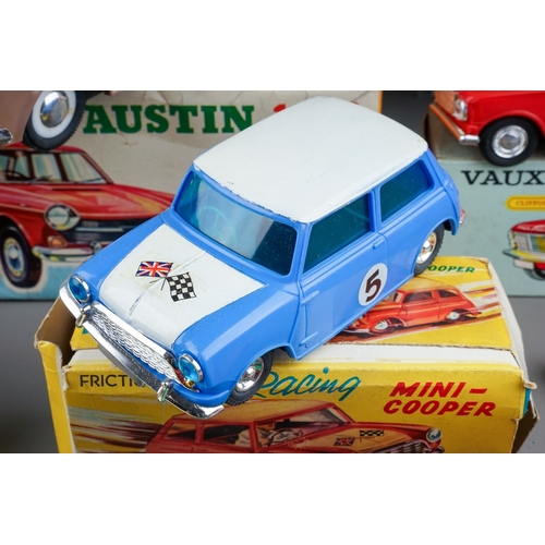 575 - A box of boxed and loose die cast, plastic and tin plate vehicles, the boxed cars comprise a Bandai ... 