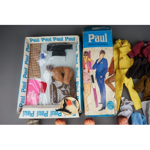 577 - Vintage Paul and Sindy interest, a box containing three Paul dolls, a Sindy doll wearing sash and cr... 