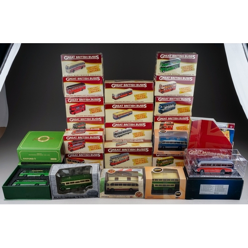 584 - A collection of twenty one modern boxed diecast buses, including a collection of fifteen Atlas Editi... 