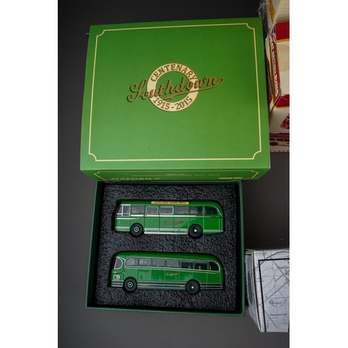 584 - A collection of twenty one modern boxed diecast buses, including a collection of fifteen Atlas Editi... 