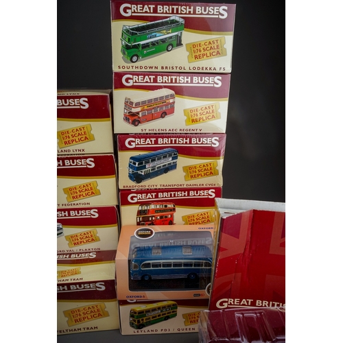 584 - A collection of twenty one modern boxed diecast buses, including a collection of fifteen Atlas Editi... 