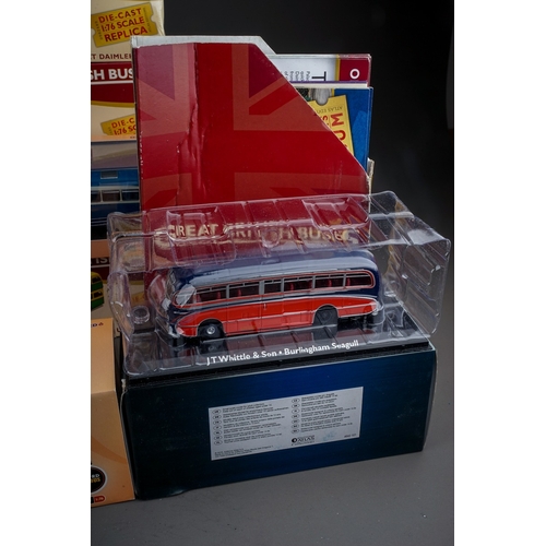 584 - A collection of twenty one modern boxed diecast buses, including a collection of fifteen Atlas Editi... 