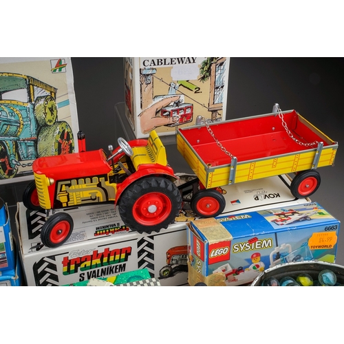 585 - A box of mostly boxed late 20th century tin plate and other childrens and collectors toys, including... 