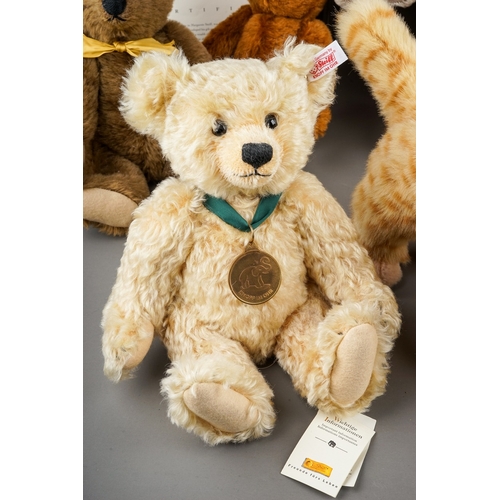 595 - A collection of Modern Steiff Teddy Bears to include: two Classic 1909s (brown and yellow plush); a ... 