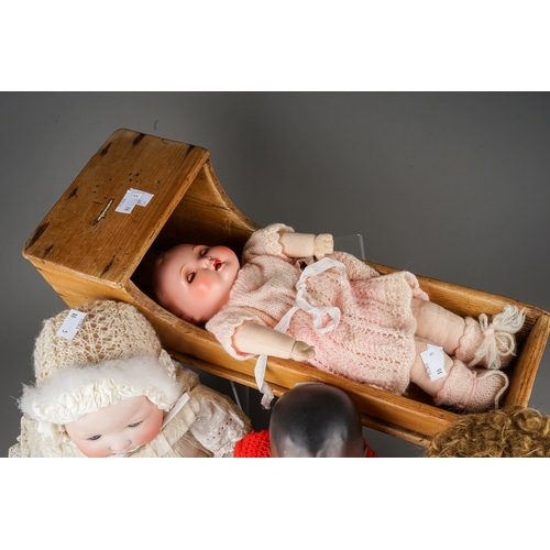 599 - Three early 20th Century German bisque head dolls to include: an Armand Marseille wearing Christenin... 