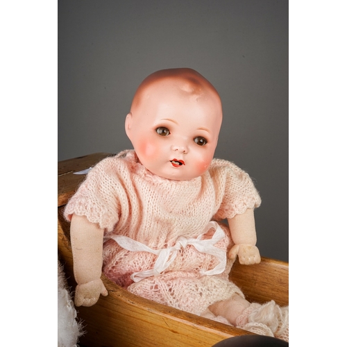 599 - Three early 20th Century German bisque head dolls to include: an Armand Marseille wearing Christenin... 