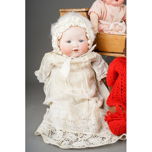 599 - Three early 20th Century German bisque head dolls to include: an Armand Marseille wearing Christenin... 