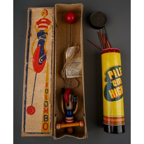 600 - Two vintage wooden toys, comprising a cardboard tube containing 