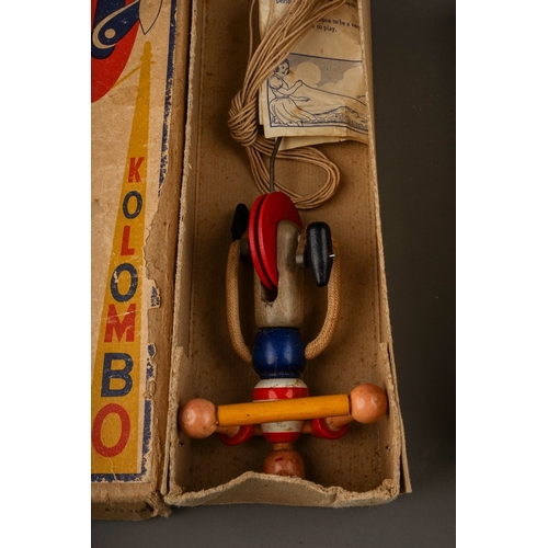 600 - Two vintage wooden toys, comprising a cardboard tube containing 