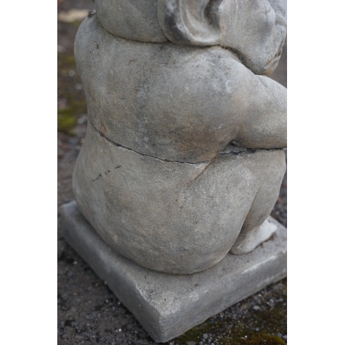 638 - A reconstituted stone garden ornament in the form of a Gargoyle