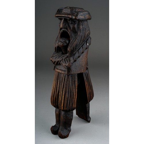 641 - A late 19th century carved treen nutcracker in the form of a Dutchman, probably Black Forest, stampe... 