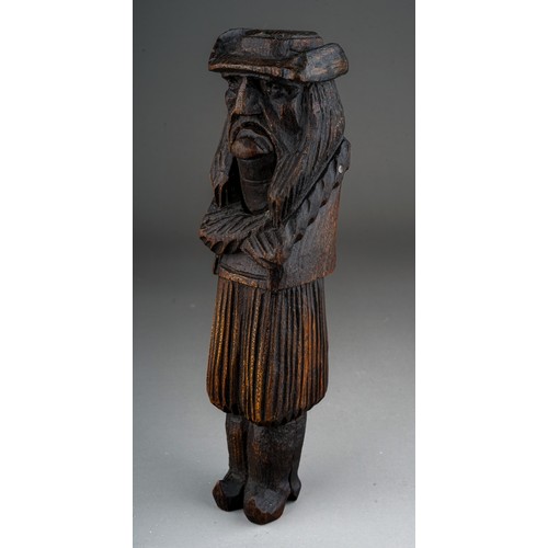 641 - A late 19th century carved treen nutcracker in the form of a Dutchman, probably Black Forest, stampe... 