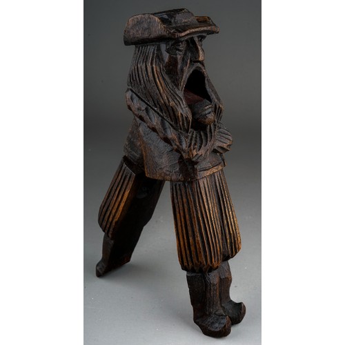 641 - A late 19th century carved treen nutcracker in the form of a Dutchman, probably Black Forest, stampe... 