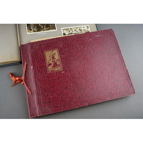 652 - A 1930s photograph album containing topographical black and white photographs, postcards etc of SS B... 