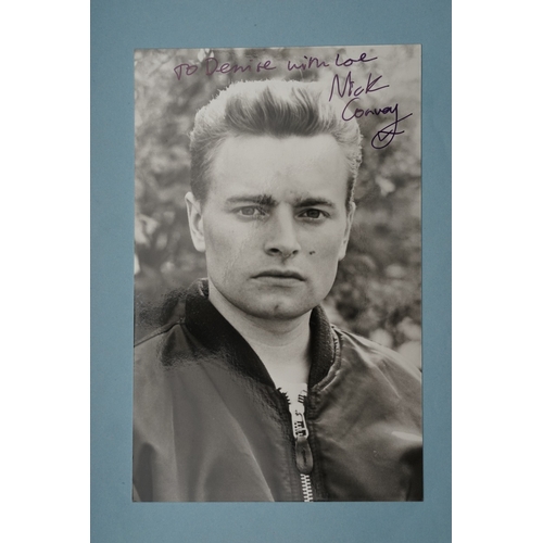 653 - Autographs, a folder containing approximately one hundred signed publicity cards, photographs and le... 