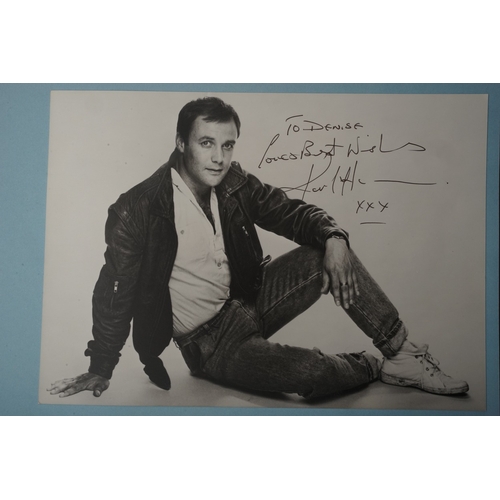 653 - Autographs, a folder containing approximately one hundred signed publicity cards, photographs and le... 