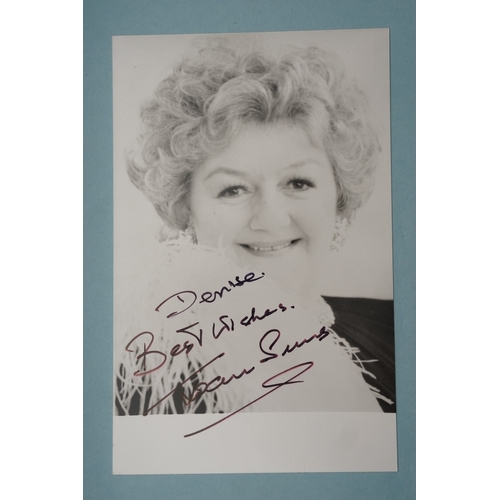 653 - Autographs, a folder containing approximately one hundred signed publicity cards, photographs and le... 