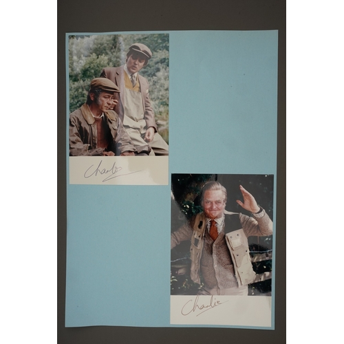 653 - Autographs, a folder containing approximately one hundred signed publicity cards, photographs and le... 