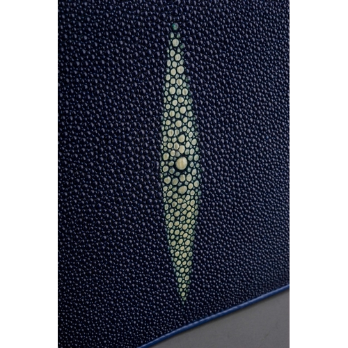 654 - A Sea Star Stingray skin navy blue handbag with cream lozenge detail to the flap, adjustable strap, ... 