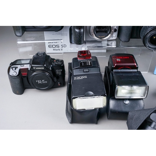 663 - A collection of Canon Cameras to include a Canon EOS 20D camera with a 18-55mm EF-S f5-5.6, a Canon ... 