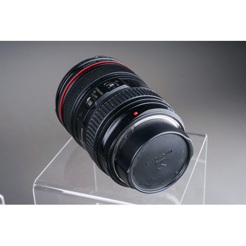 665 - A Canon EF 24-105MM MACRO L IS USM f/4 lens along with a Canon EF 16-35MM f/4 L IS USM lens and Sigm... 