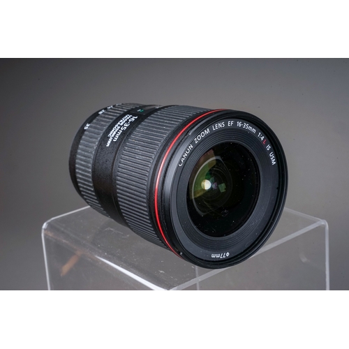 665 - A Canon EF 24-105MM MACRO L IS USM f/4 lens along with a Canon EF 16-35MM f/4 L IS USM lens and Sigm... 