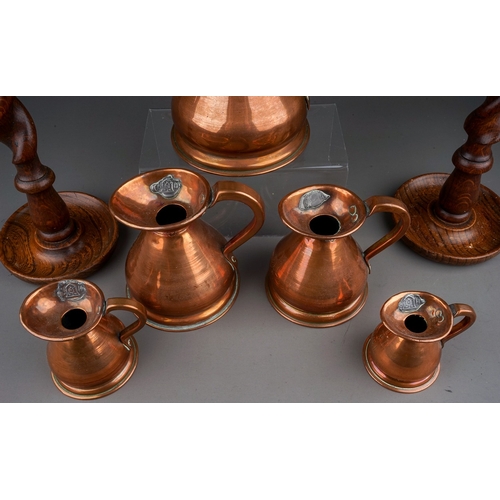 675 - A set of five 20th century copper haystack measures, tallest 16.5cm, smallest 7.5cm, together with a... 