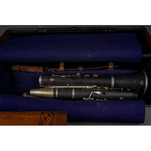 677 - A cased Hawkes & Son Excelsior Class clarinet, a small quantity of cloth badges including 'The Refer... 