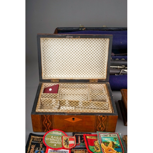 677 - A cased Hawkes & Son Excelsior Class clarinet, a small quantity of cloth badges including 'The Refer... 