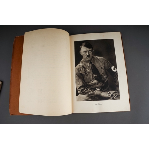 679 - A 1930`s German Kampf um's Dritte Reich gilt embossed album, containing colour cards of the Nazi par... 