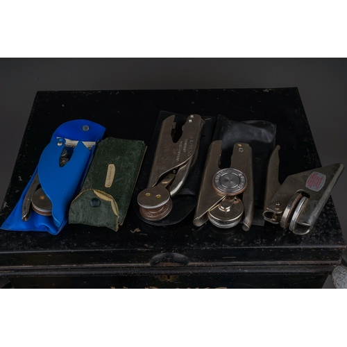 685 - An early 20th century metal deed box containing an assortment of vintage stationery embossers, compr... 