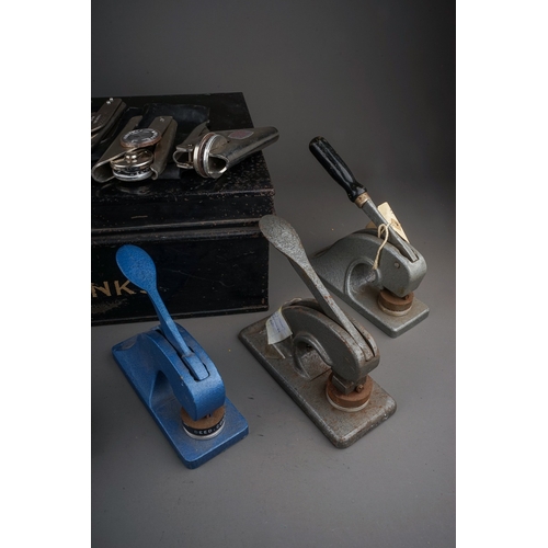 685 - An early 20th century metal deed box containing an assortment of vintage stationery embossers, compr... 