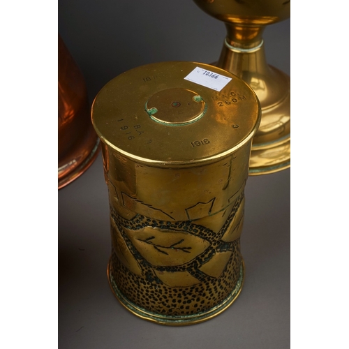 690 - A collection of brass and copperware to include: Duplex oil lamp base; a large serving jug, warming ... 