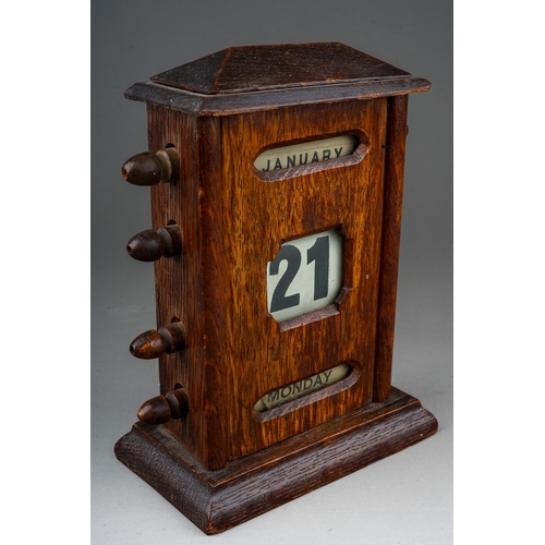 693 - An Edwardian oak perpetual desk calendar, approx 17cm high