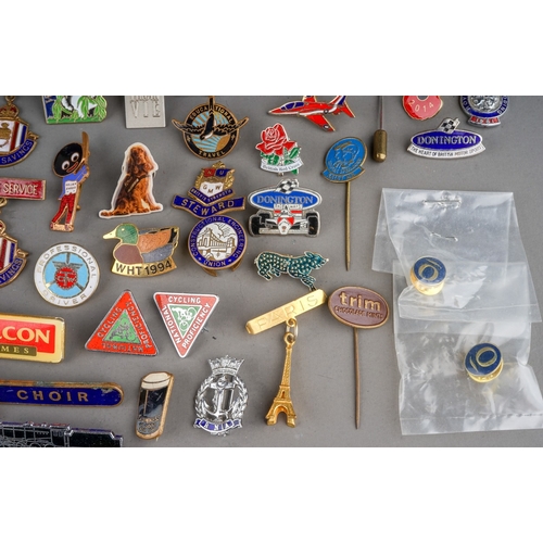 695 - A tin of enamel and pin badges and medallions, etc, including a 1942 military Physical Training meda... 