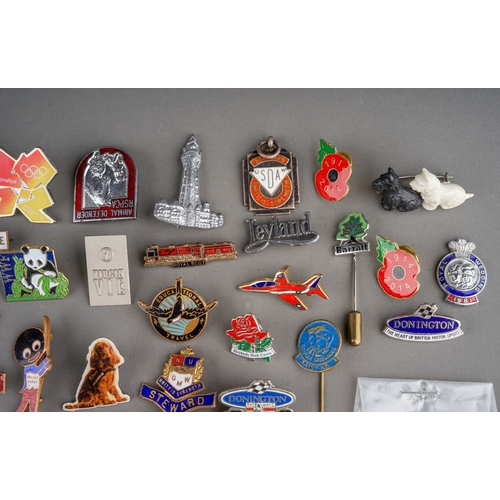 695 - A tin of enamel and pin badges and medallions, etc, including a 1942 military Physical Training meda... 