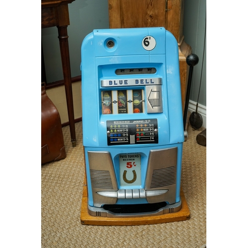 709 - Mill Blue Bell front slot machine ( one arm bandit), with key, working order, takes British 6D coins